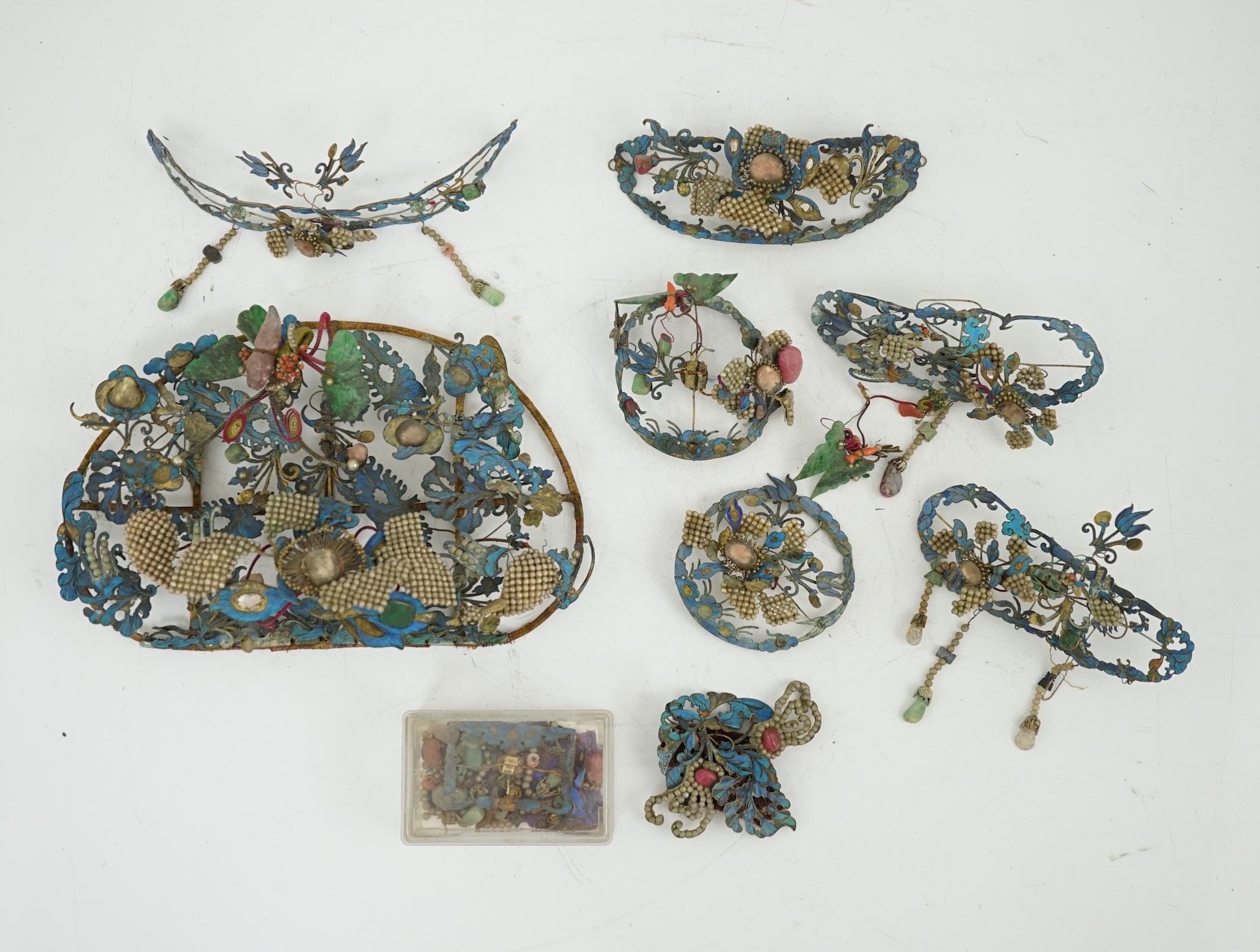 A group of eight Chinese kingfisher feather, jade, seed pearl, coral and hardstone mounted headdresses and ornaments, late Qing dynasty, some losses